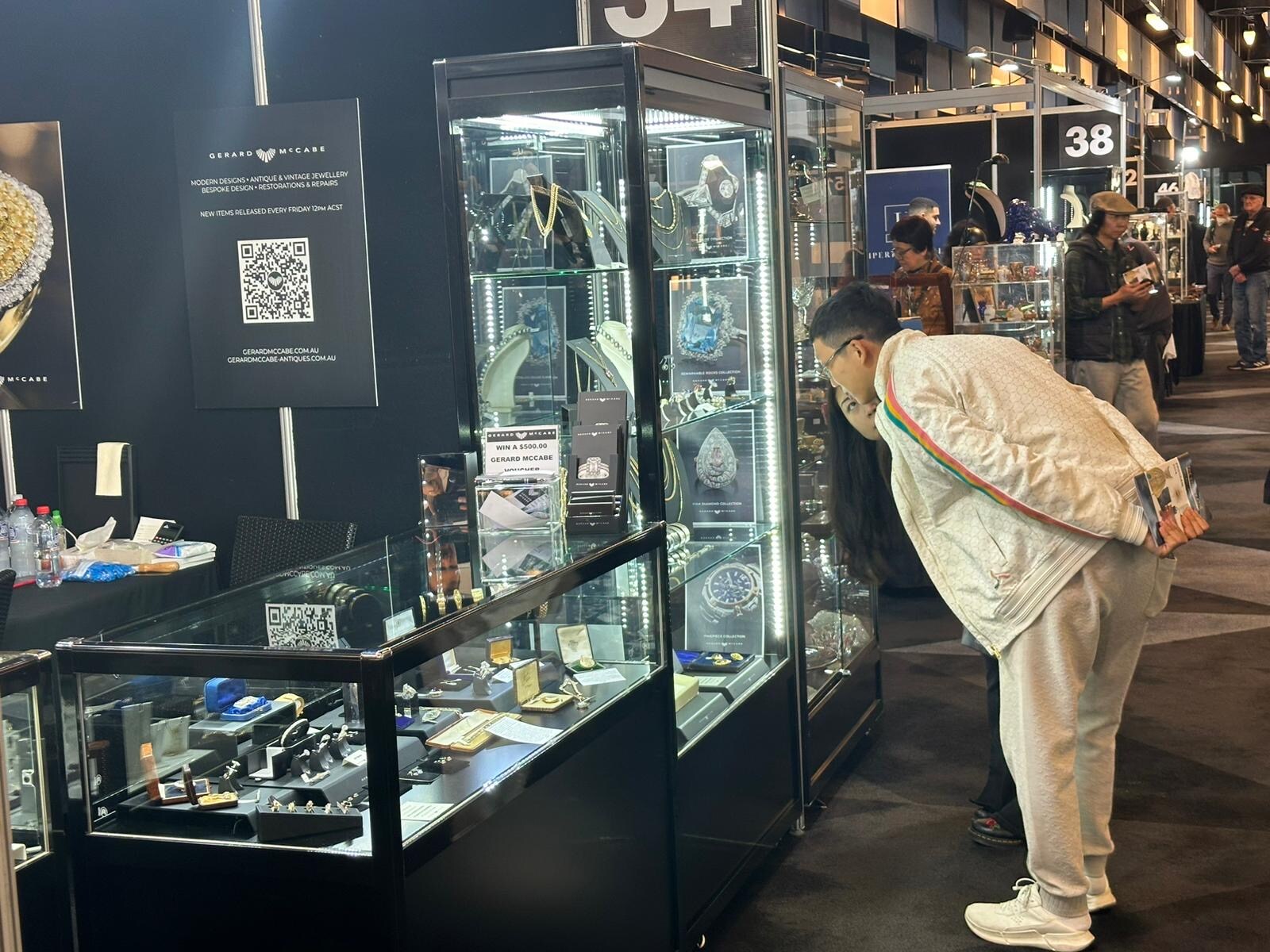 A customer browsing our collection of antiques at The Sydney Fair